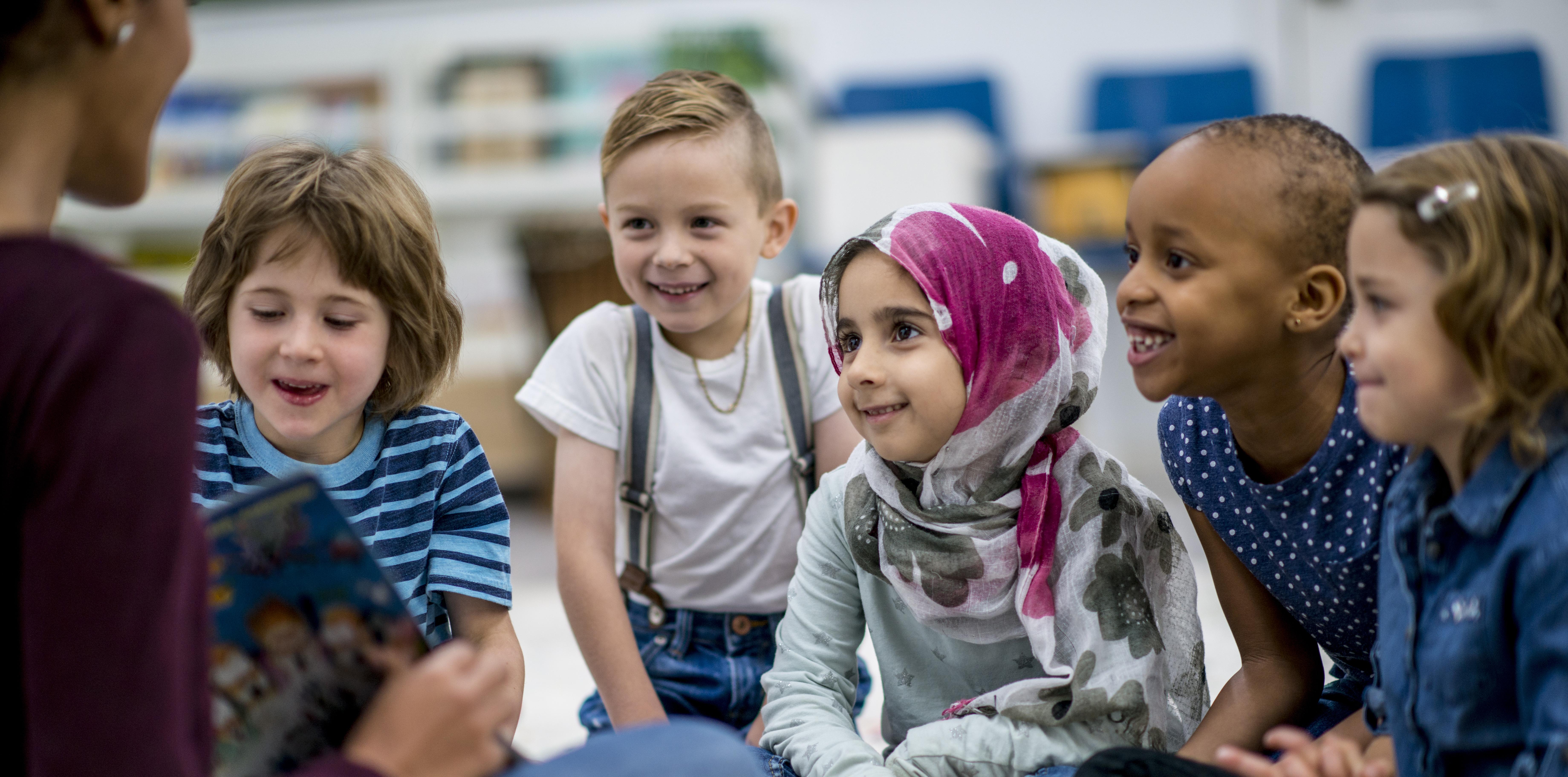 teacher reading to group of children