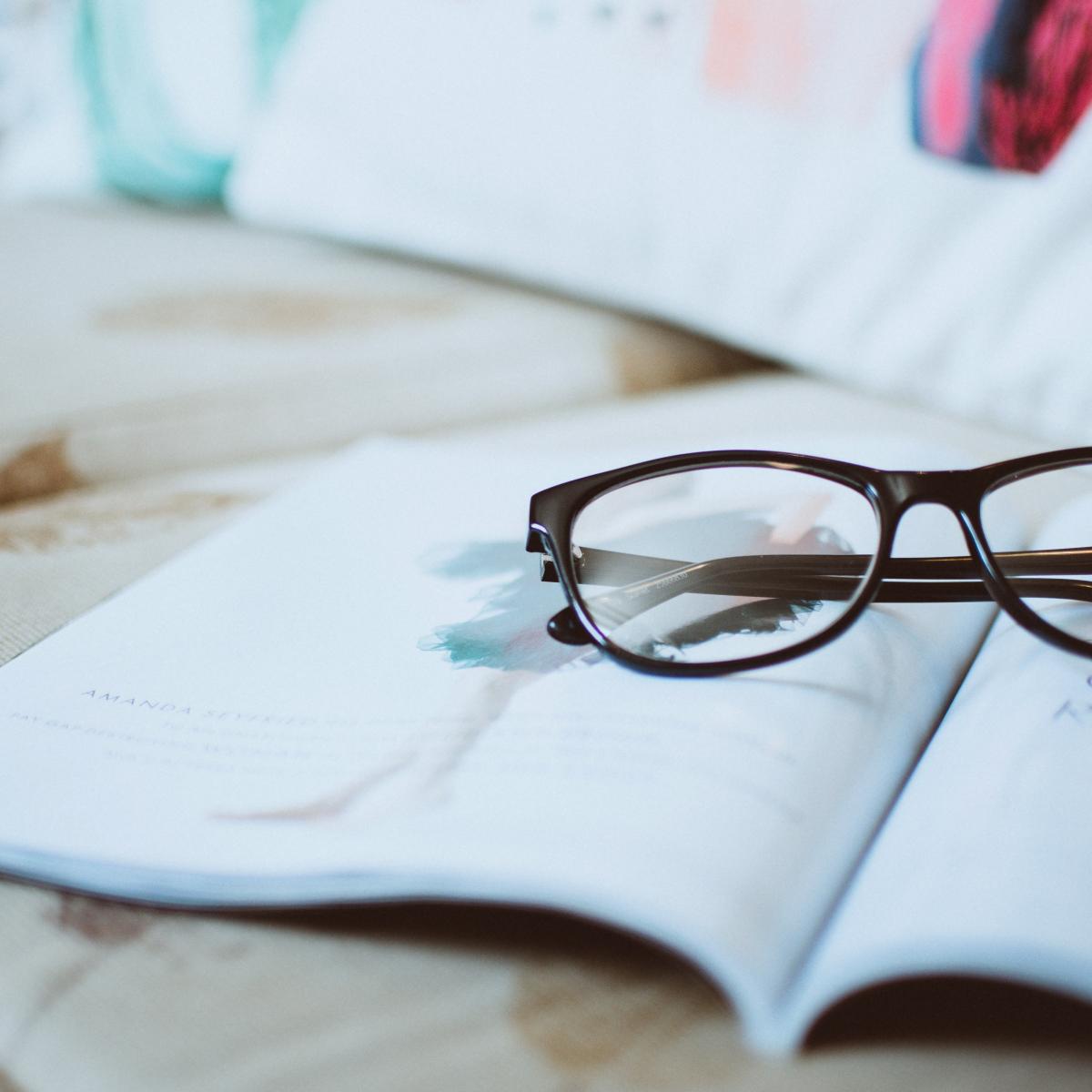 GLasses on top of book