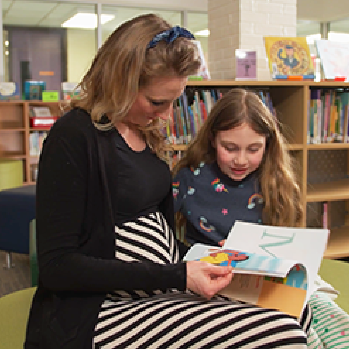 mother and child reading together